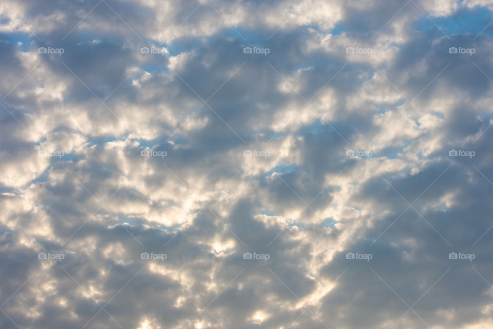 The beauty of the sky with clouds and the sun.