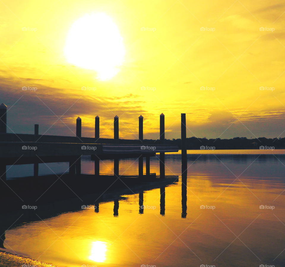 Hot White Sun. This sunset was at its peak when I photographed it and as a result it bounced off the dock to create a super reflection!