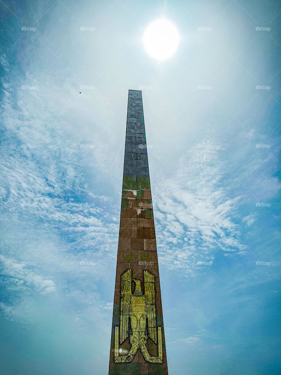 Obelisk with the the Egyptian Golden eagle coat of arms 