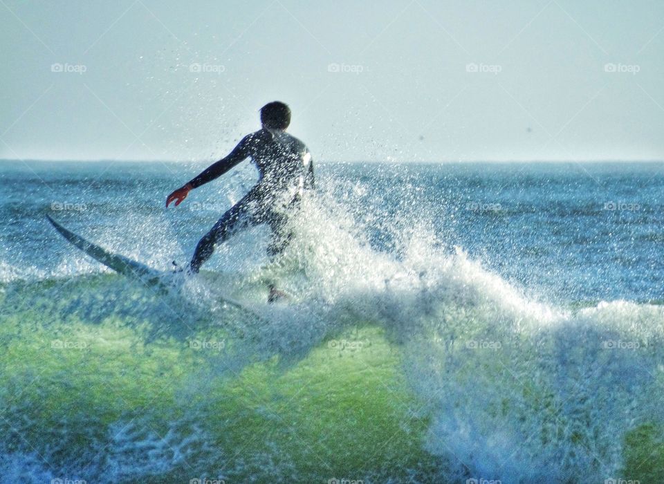 Surfer creating a wave