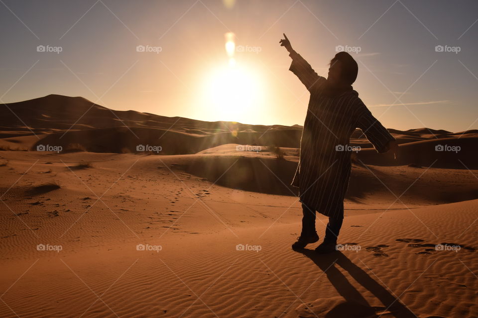 Berber enjoying sunset at Sahara desert, Morroco