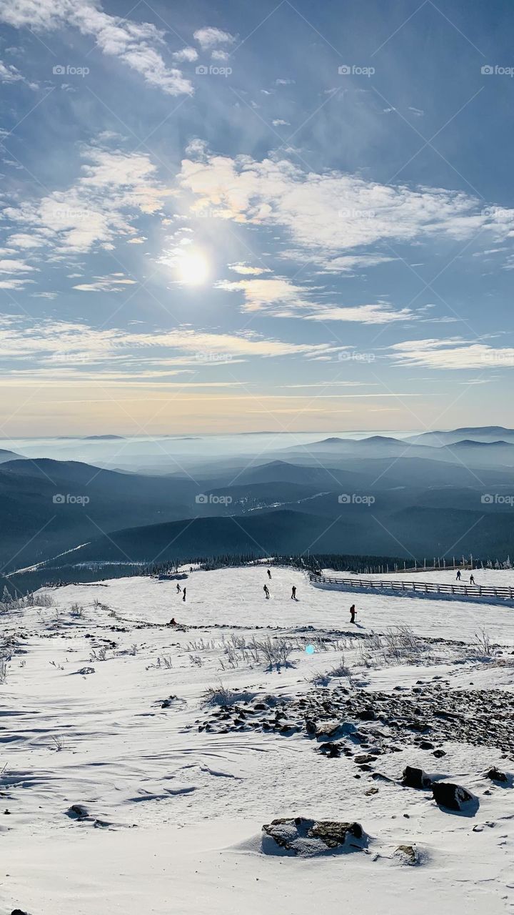 Ski run in a high-altitude resort in clear weather