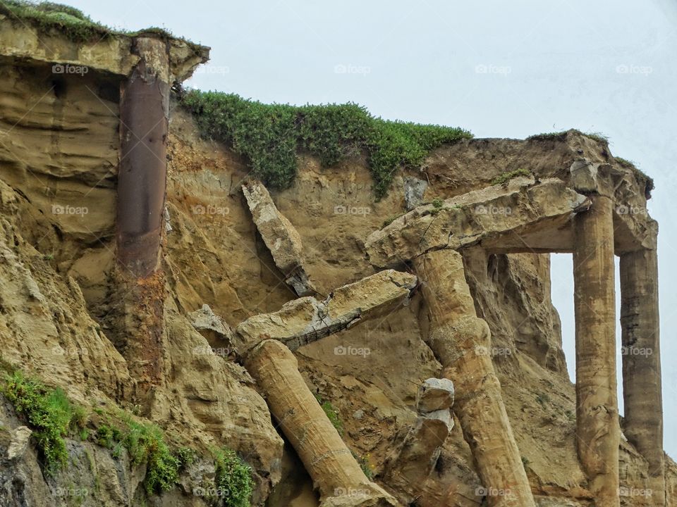 Ancient Ruins Crumbling On A Cliffside