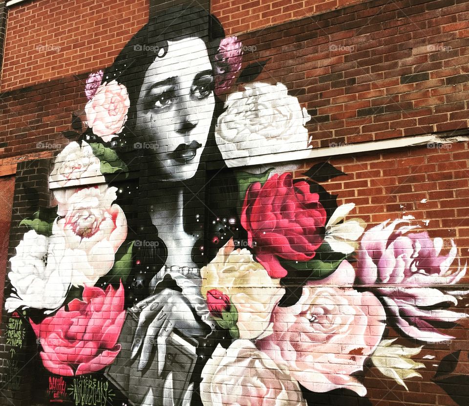 Lady and pink flowers street art 