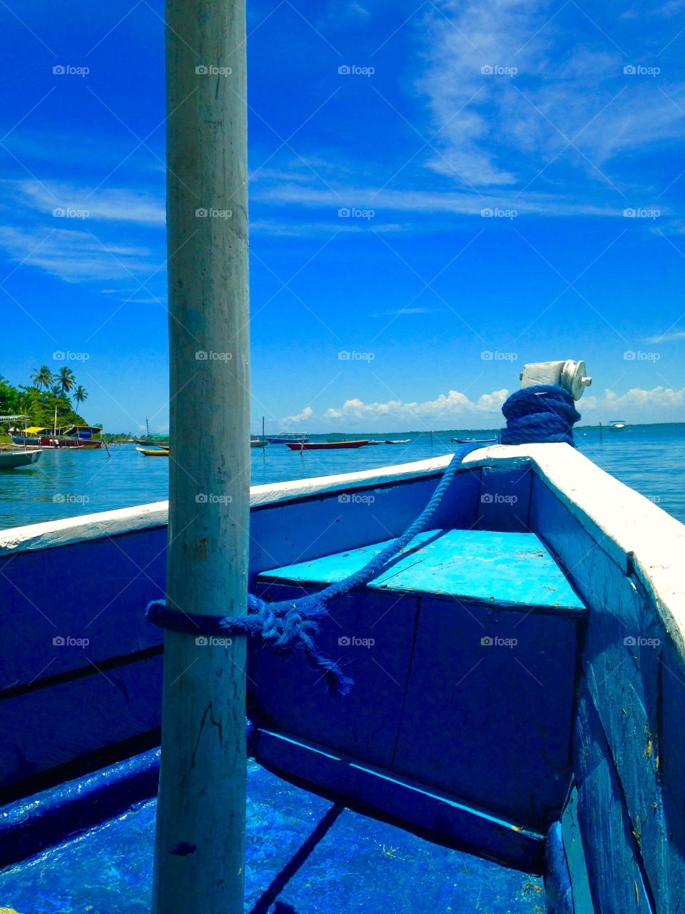 blue boat, blue sky and blue sea in the summer of Baia de Todos os Santos