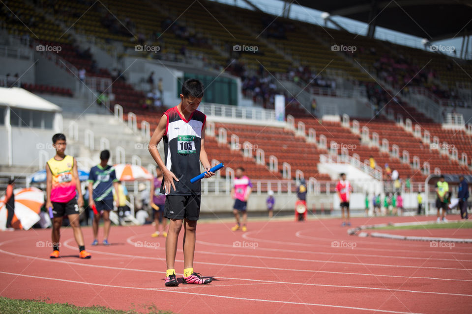 Athletic athlete in the track for the race