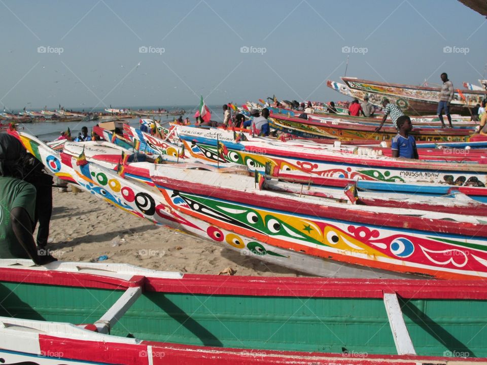 The boats await at low tide in the fishing town of Tanji in Gambia. 