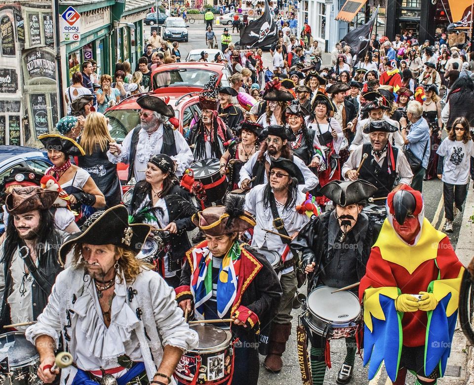 A large parade of Pirates, with the odd parrot, march through Hastings Old Town, for the annual Pirate Day celebration.
