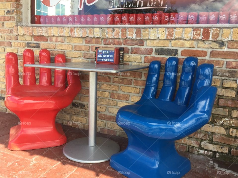 Table with hand shaped chairs
