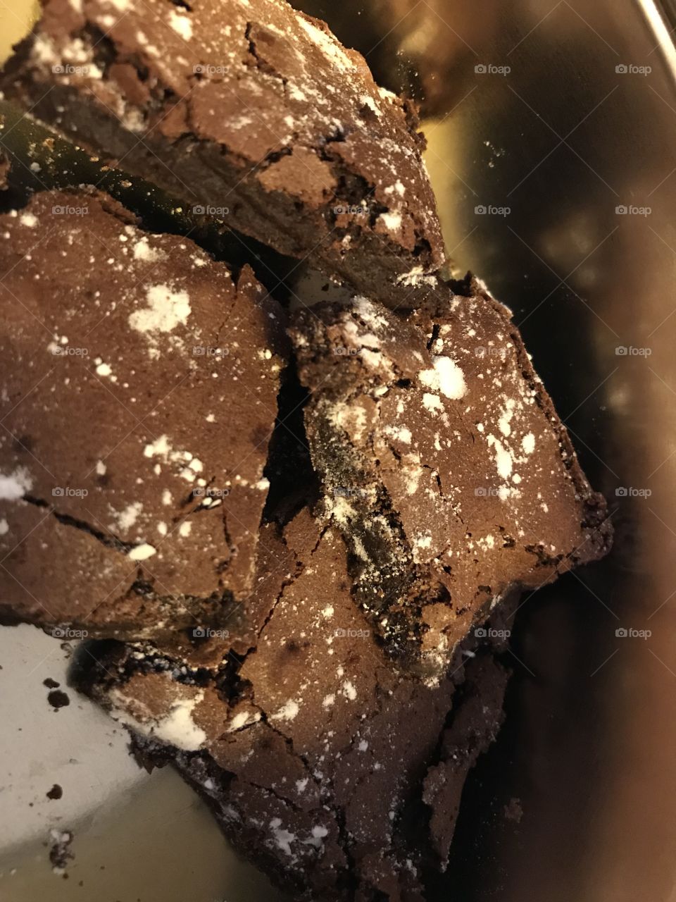 Homemade brownie with baking sugar on top.                                           