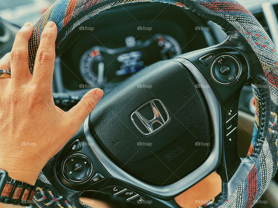 Woman’s hand driving Honda, driving in cars, view of a driver, driving a Honda pilot, driver’s perspective, hand on the steering wheel