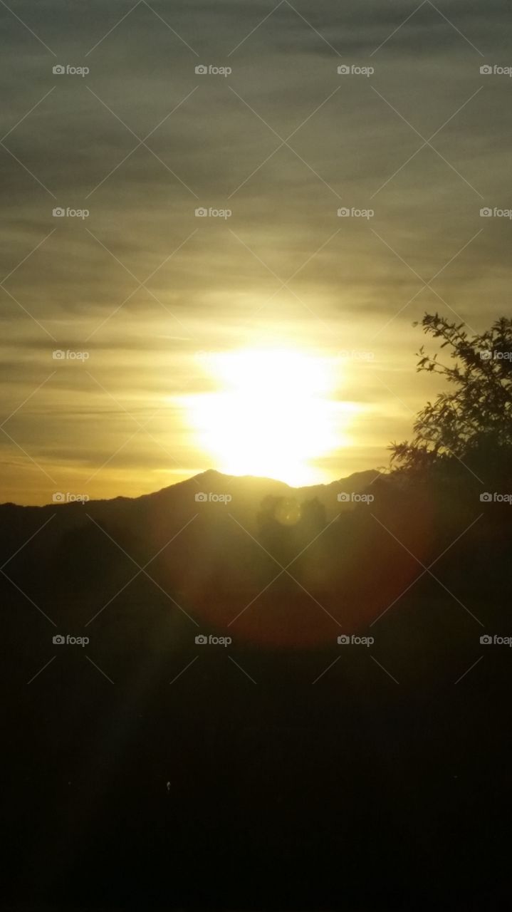 A Sunsetting over a Mountain is Always 
A Beautiful site to see , to me . That is.
Always Captivating , Illuminating , 
A GLORIOUS  site to see.  To me.
Who could not want to stare at such 
A site . That makes a better night .