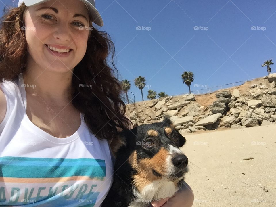 Girl with dog at the beach 