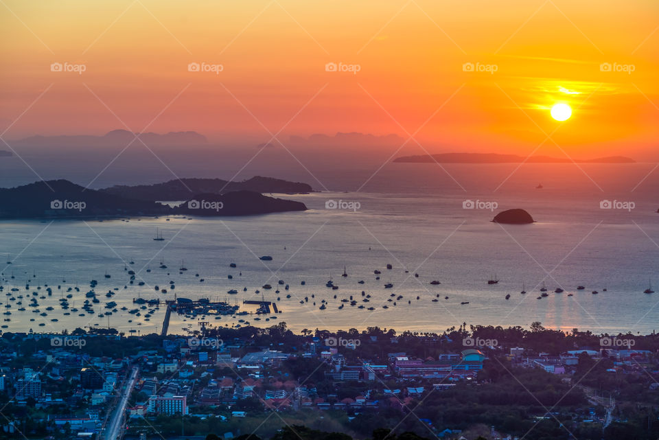 Beautiful big sun rise above Phuket bay in Thailand