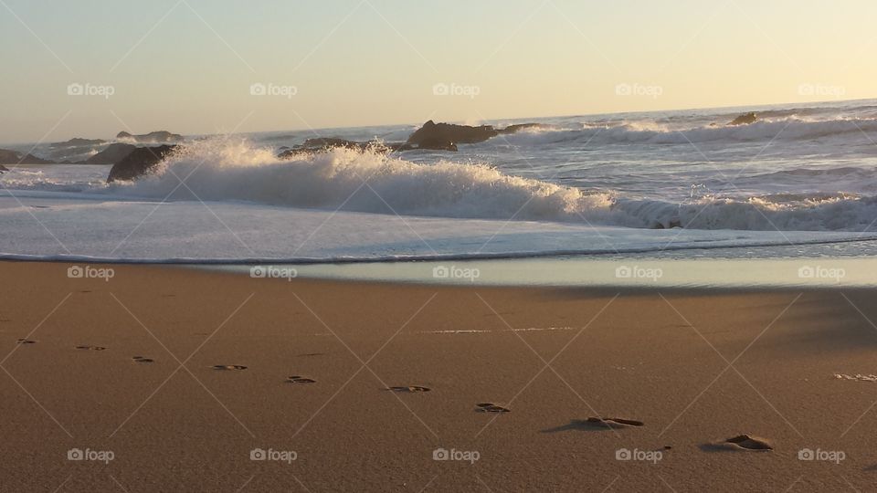 Serene empty beach in Santa Cruz, California with one set of footprints
