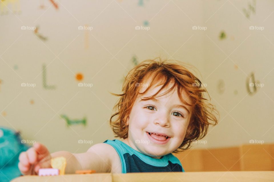 Red hair boy smiling 