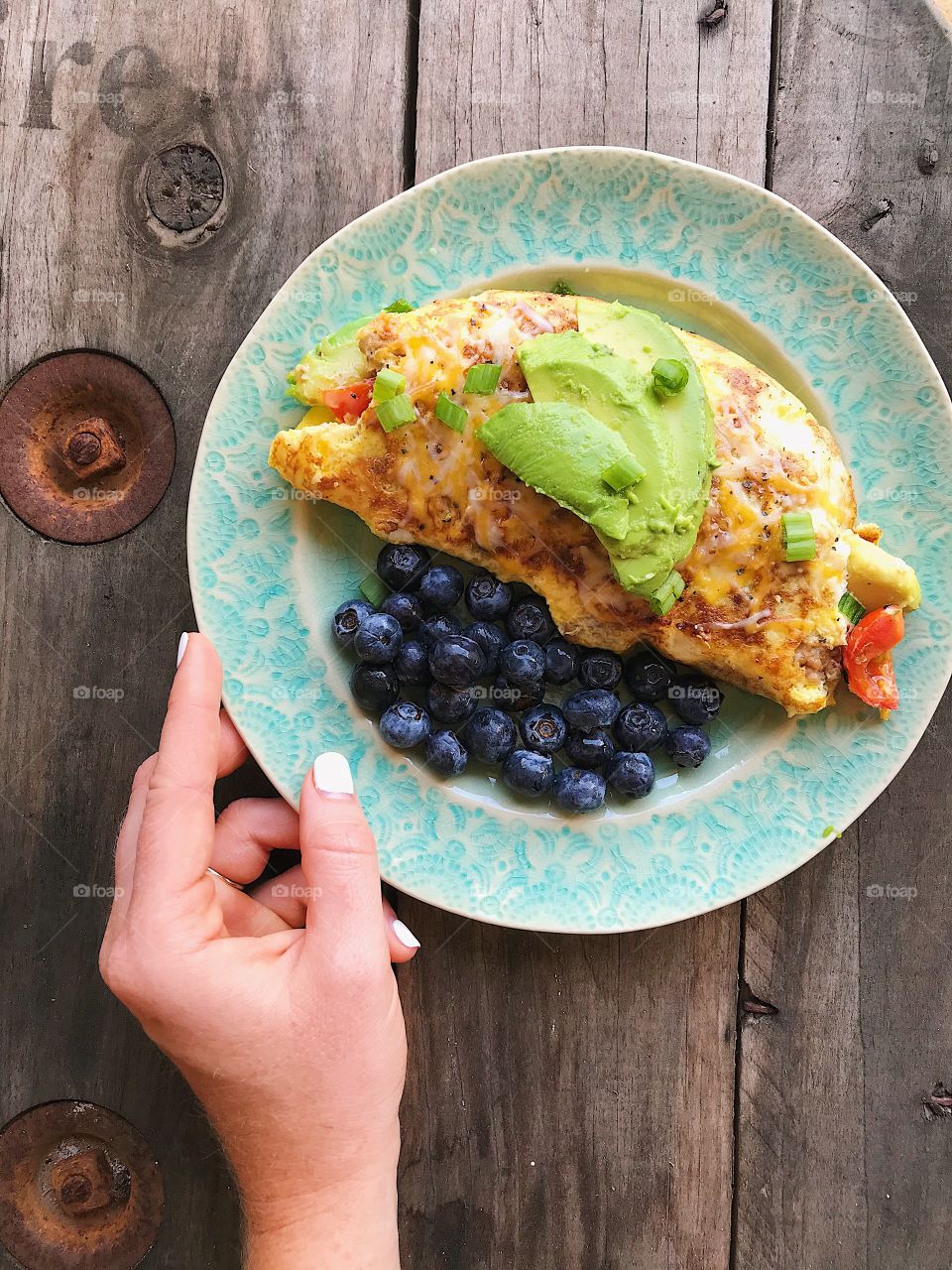 Fresh veggie omelette with a side of fresh blueberries make for the perfect morning meal!