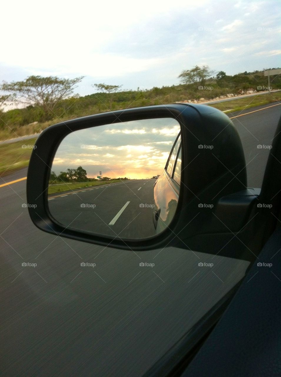 Sunset on the car mirror