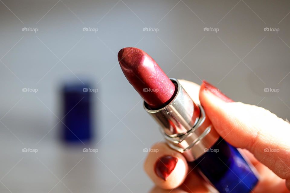 Lipstick in woman's hand