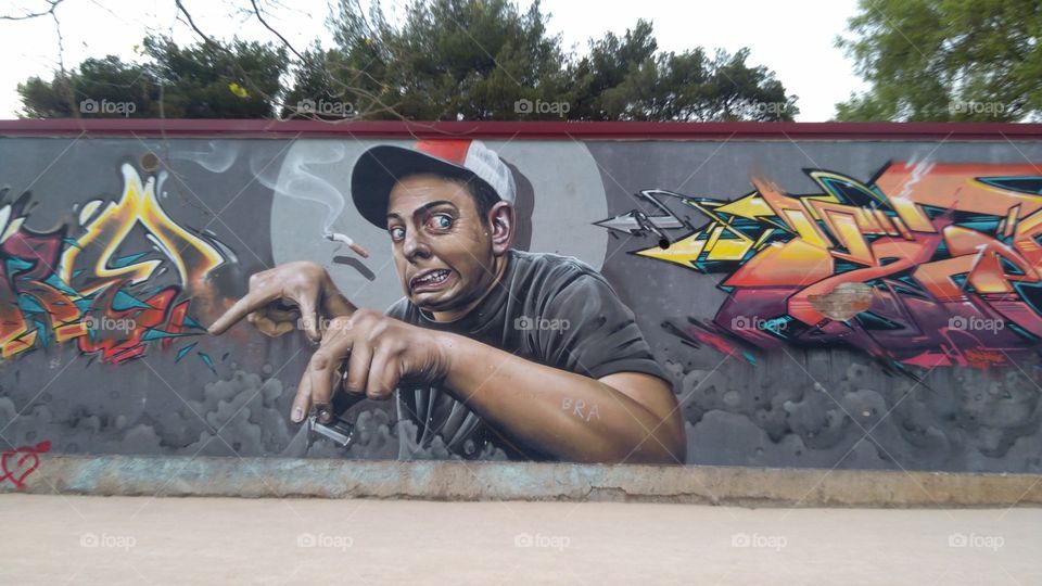A Graffiti of a Man with the Hat and the Cigarette