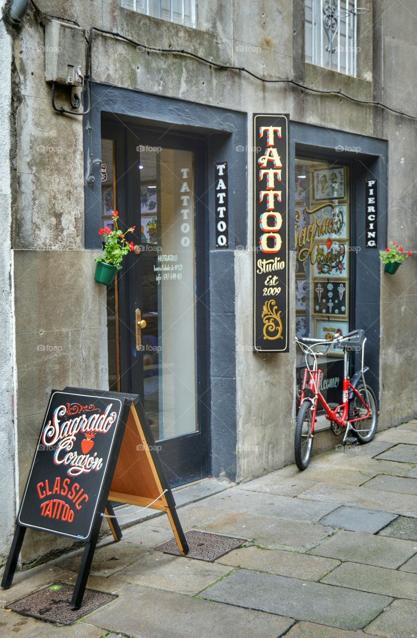 Tattoo parlour. Tattoo parlour in the old city, Santiago de Compostela, Spain