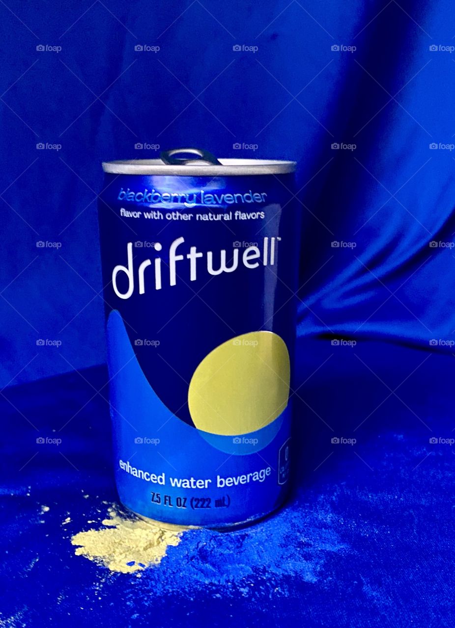 Driftwell with a blue background and yellow and blue powdered paint