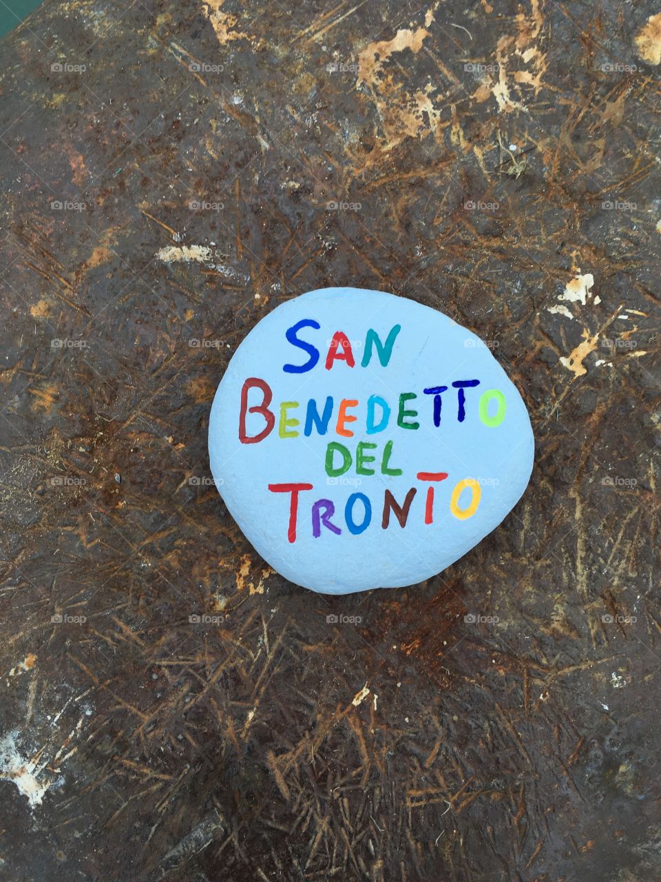 San Benedetto del Tronto, souvenir on a carved stone over a rusty bollard