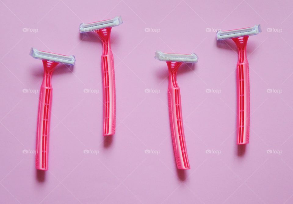 Pink razors on pink background
