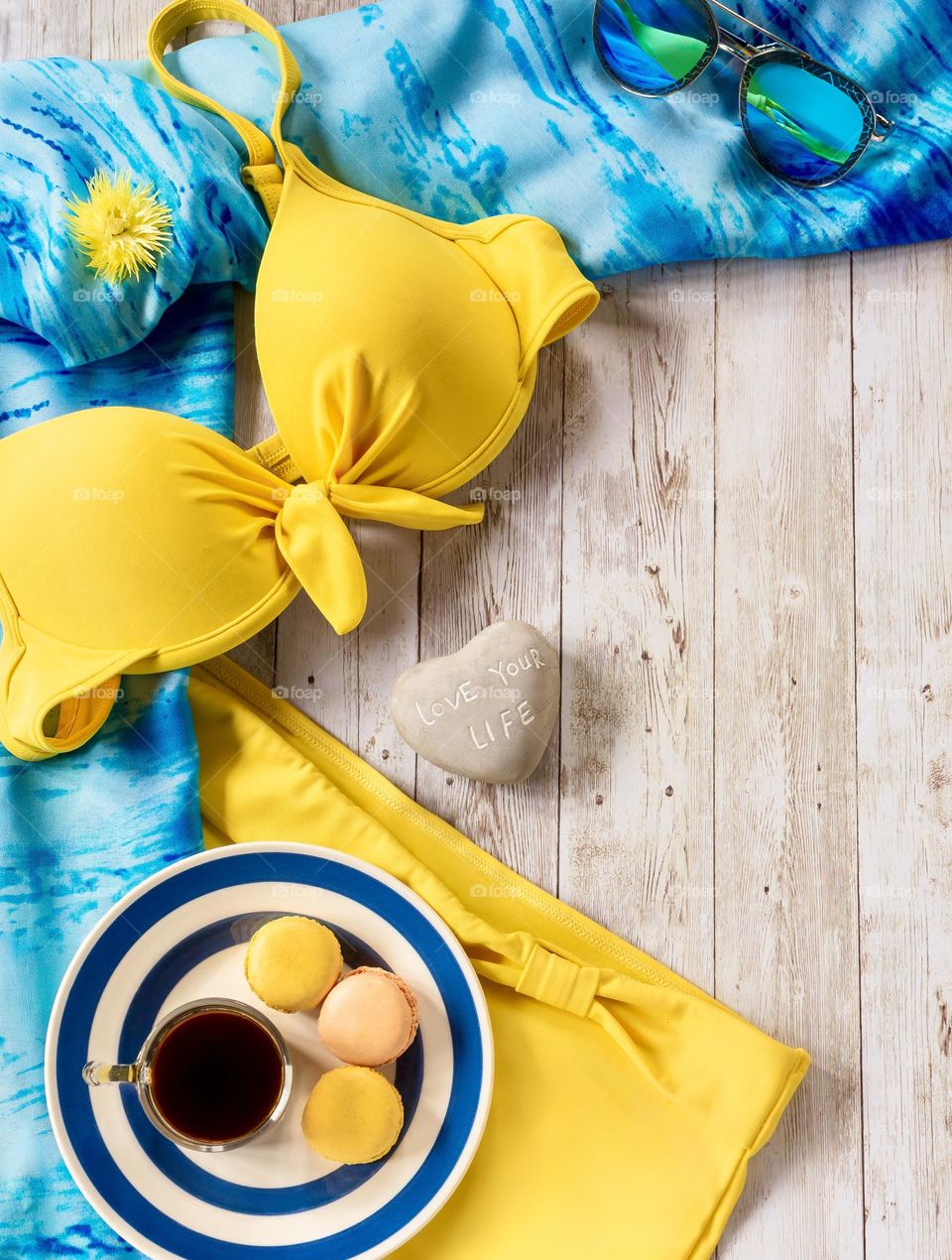 Yellow bikini with turquoise scarf flat lay