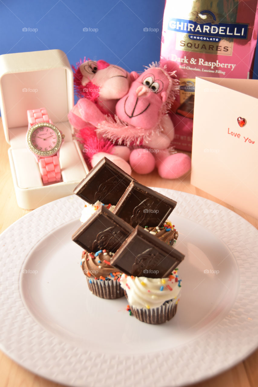 Ghirardelli chocolate on top of cupcakes, plated for presentation