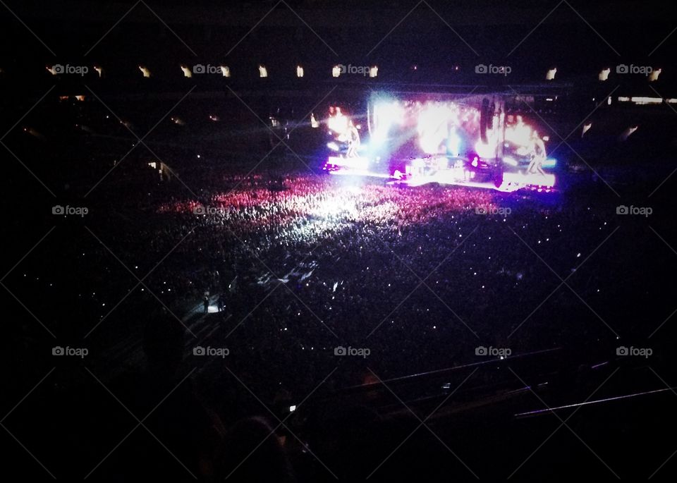 Rock concert in a stadium with thousands of people 