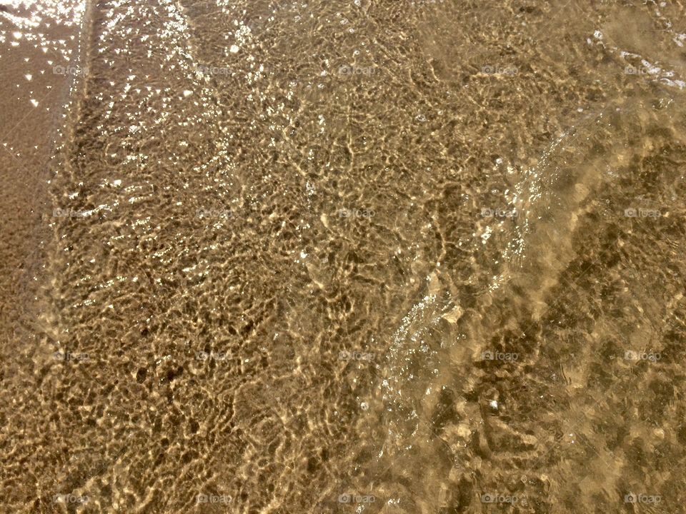 Sand under water lay