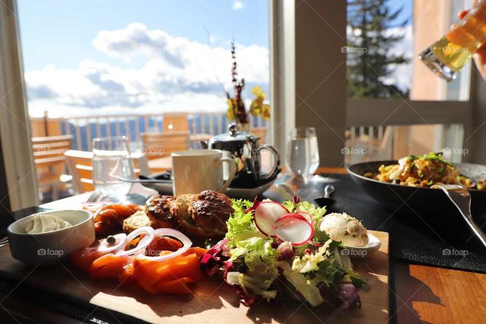 Food on a table by the window 