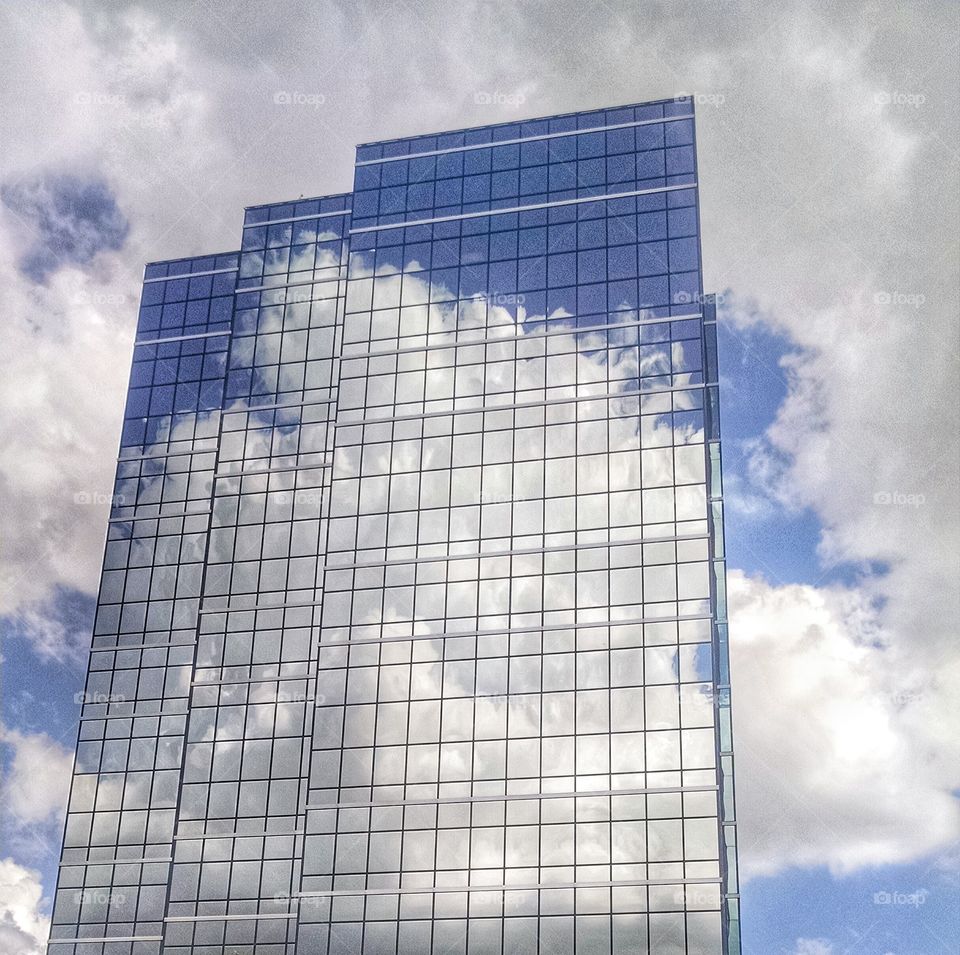 Cloudy blue sky building reflection 
