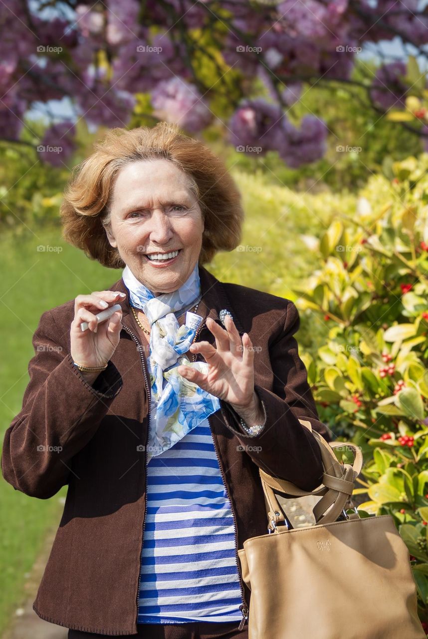 My mother on her 70th birthday and in the early stages of dementia, she appears happy but there’s a faint look of confusion in her eyes as she tries to figure out what her hands need to do to wave.