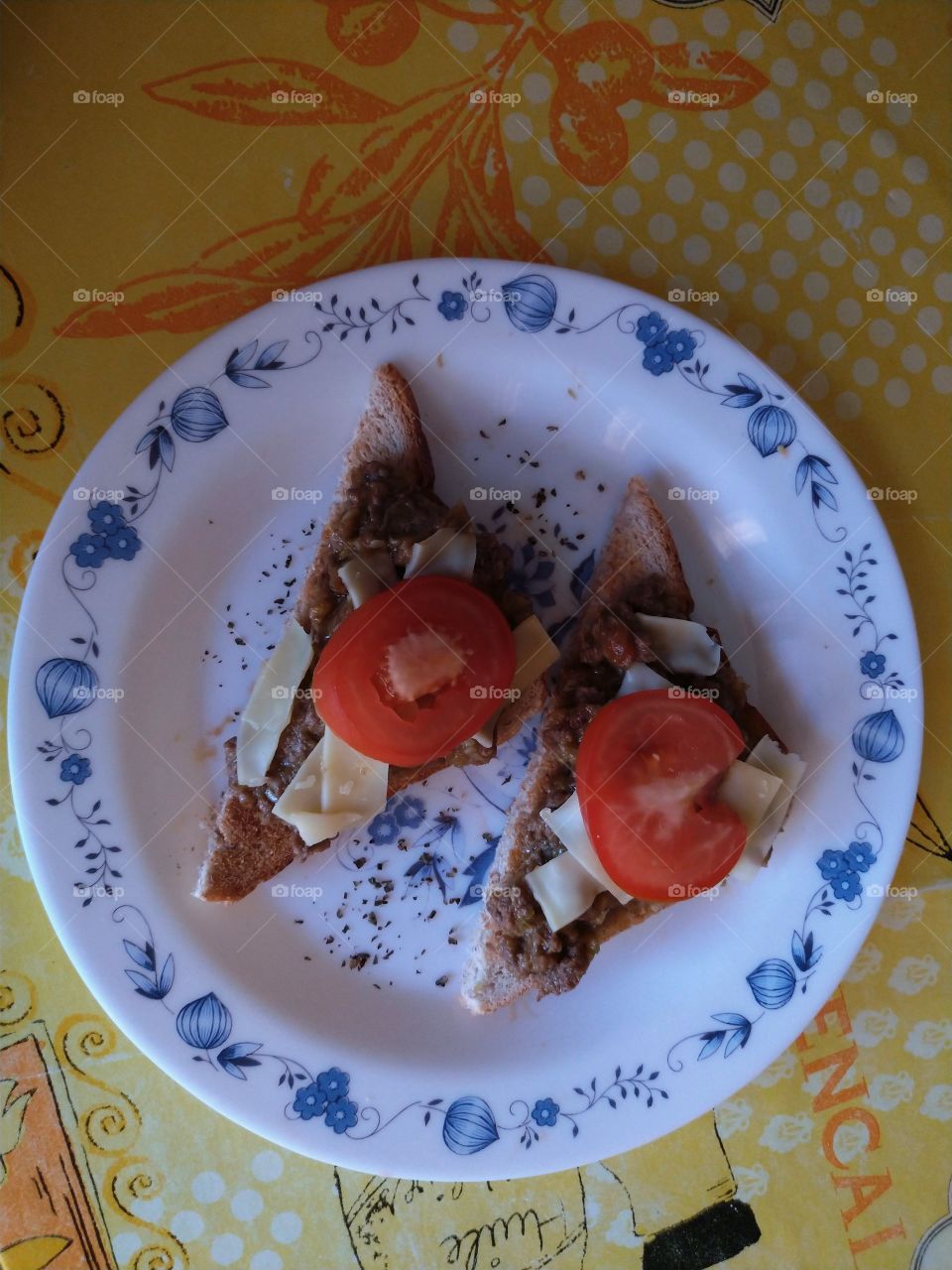 Snack - Zucchini and chopped steak on bread toast with tomato and cheese on top