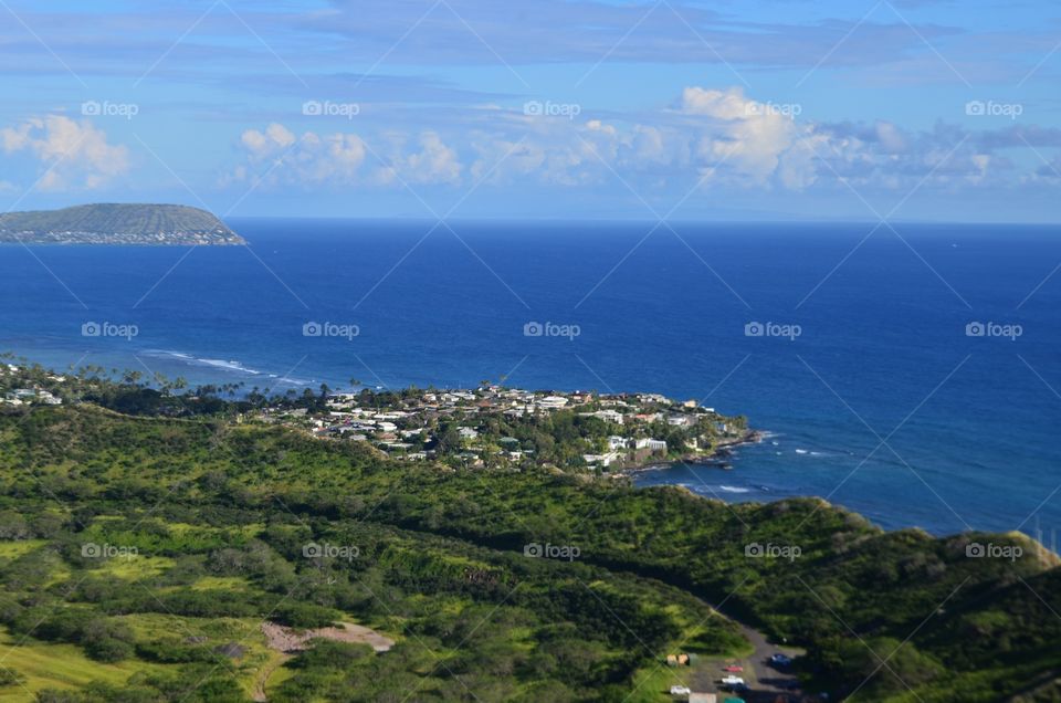 Diamond Head Hawaii, view on top of the mountain.  Lush Forest ,Town , city, ocean,blue skies and clouds