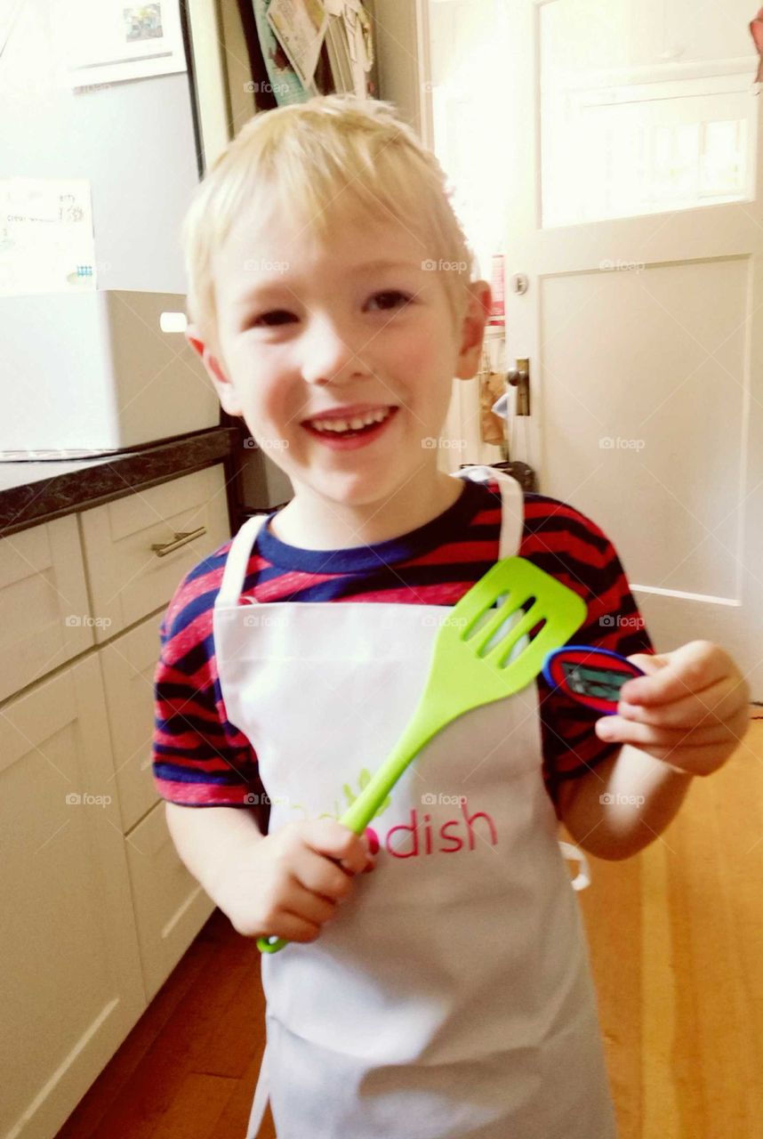 boy chef with apron and spatula