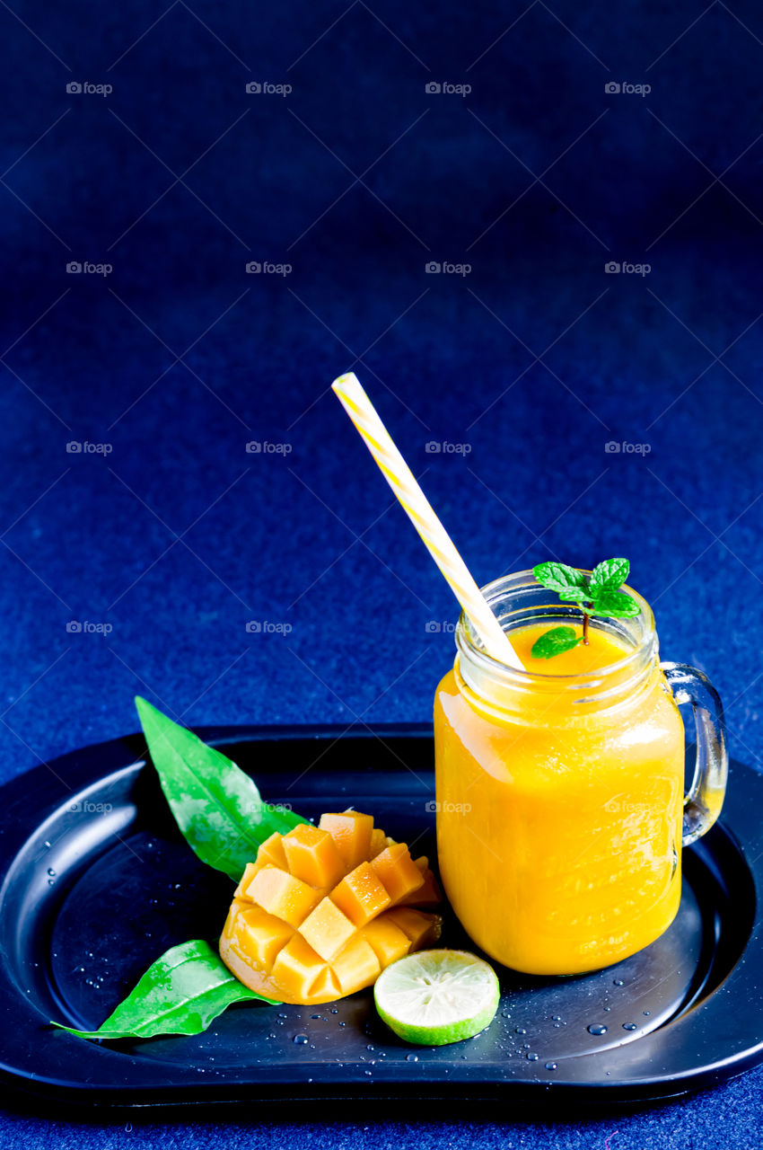 Cool mango juice to beat the heat. Healthy refreshment for hot summer.