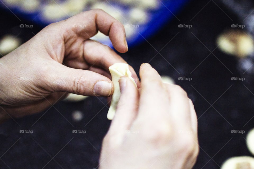 Person making food with dough