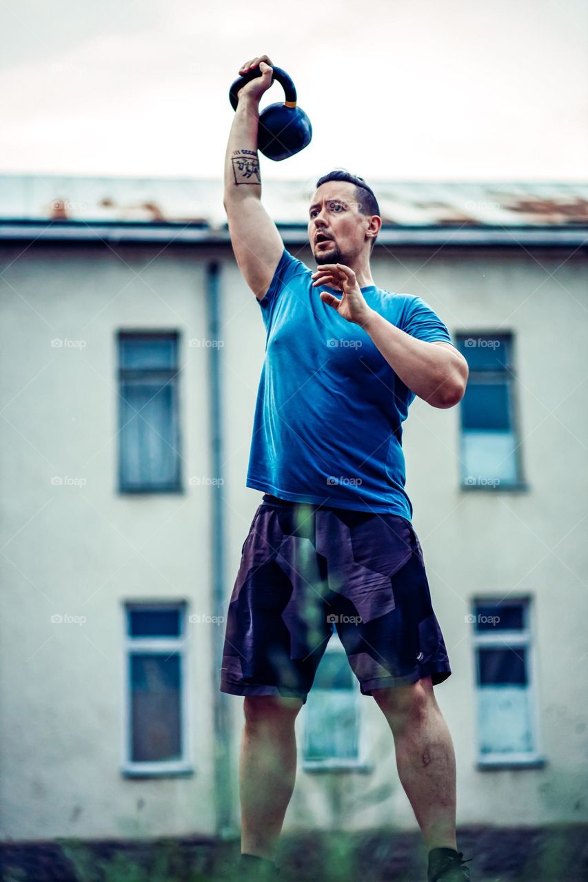 Portrait of real man during workout.