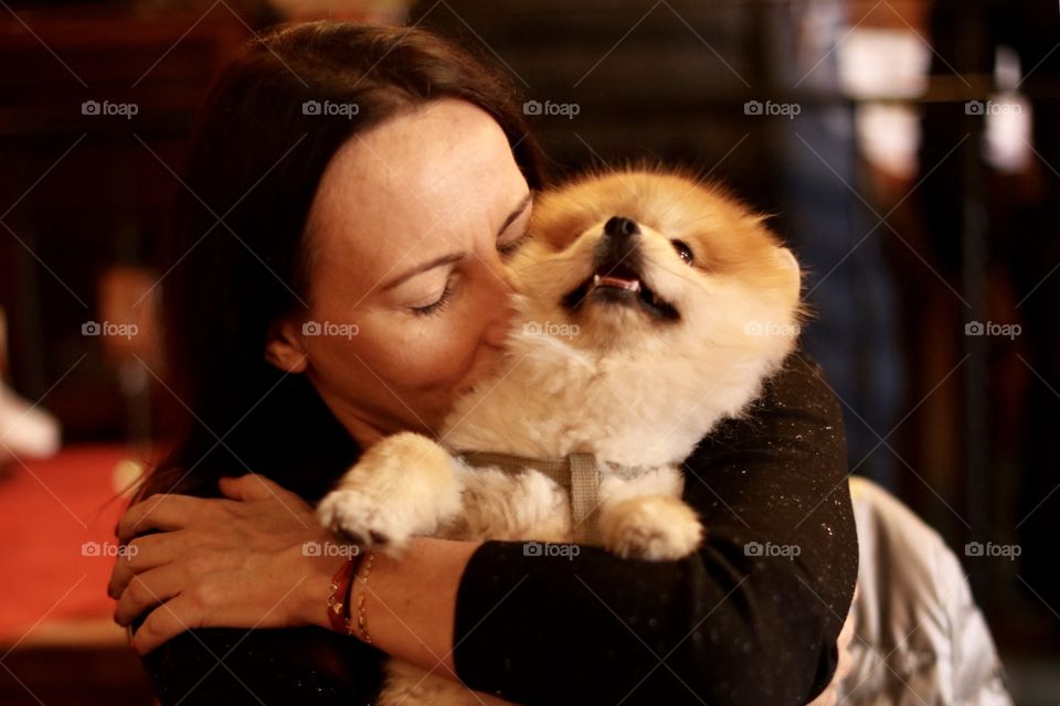 the woman hugs the dog