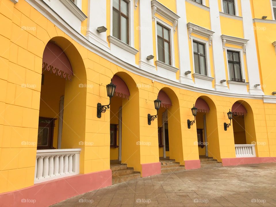 Yellow building with arches in Odesa, Ukraine 