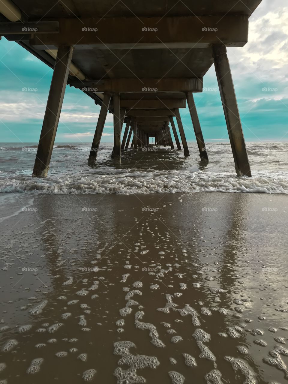 Underside of jetty over water