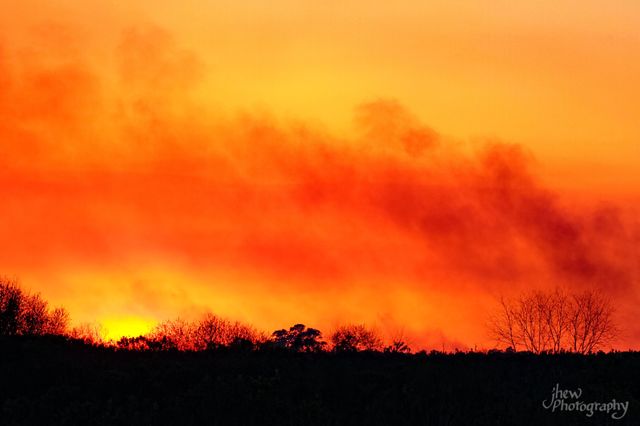 Sunset mixed with smoke from a controlled burn