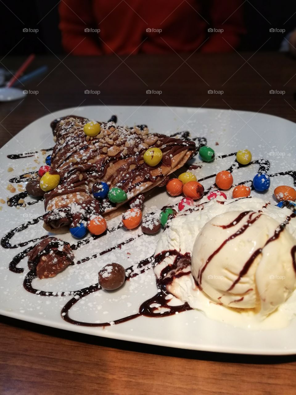 ferrero crepe with vanilla ice cream and some yummilicous m&ms on top.. food for the soul. . mid week dessert to get you going through the rest of the week...