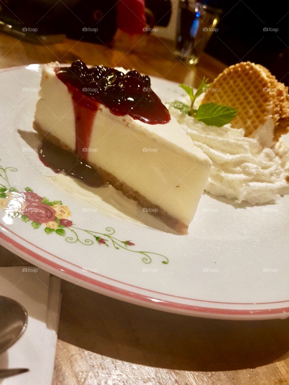 Cheesecake and cherries and whipped cream