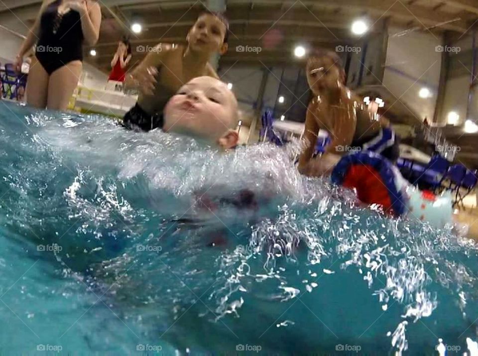 Little boy's first swim