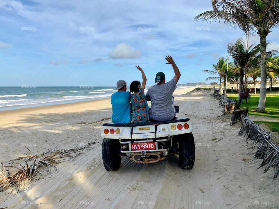 Family having fun during a beach buggy ride