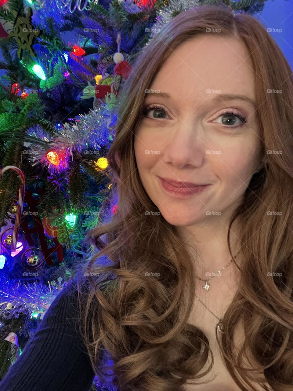 Woman by a Christmas tree 